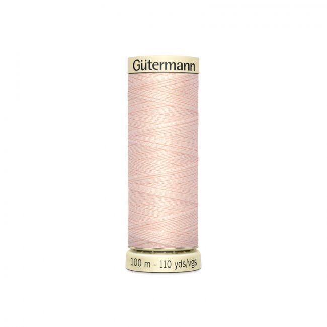 Univerzální šicí nit Gütermann v béžové barvě s nádechem růžové 210