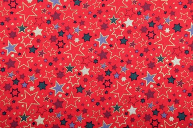 Vánoční látka z bavlny v červené barvě s potiskem barevných hvězdiček 12714/015