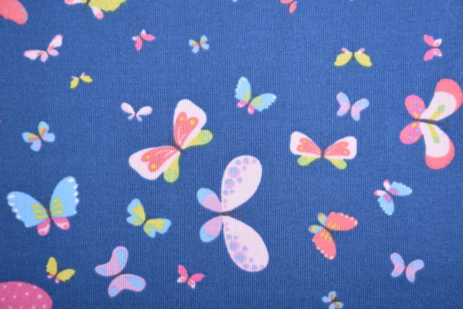 Bavlněný úplet v modré barvě s potiskem motýlů 16614/008