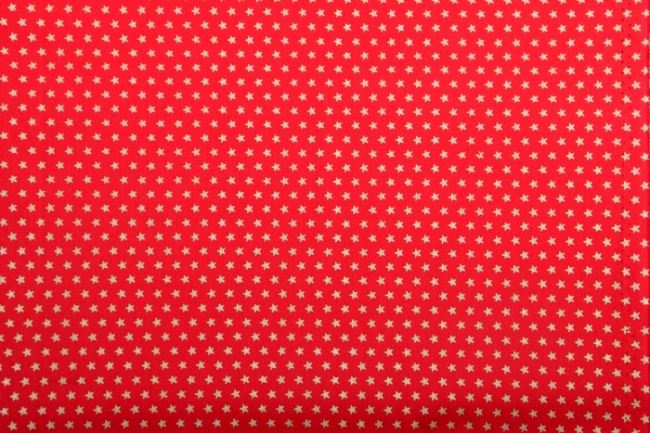 Vánoční látka z bavlny v červené barvě s potiskem hvězdiček 12702/015