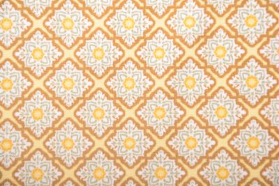Bavlněný úplet v žluté barvě s potiskem ornamentů 210409.0004