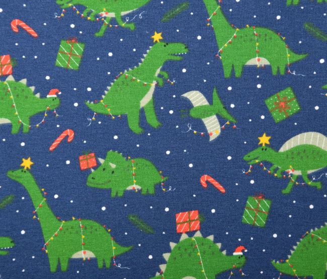 Vánoční bavlněný úplet v modré barvě s potiskem dinosaurů 18739/008